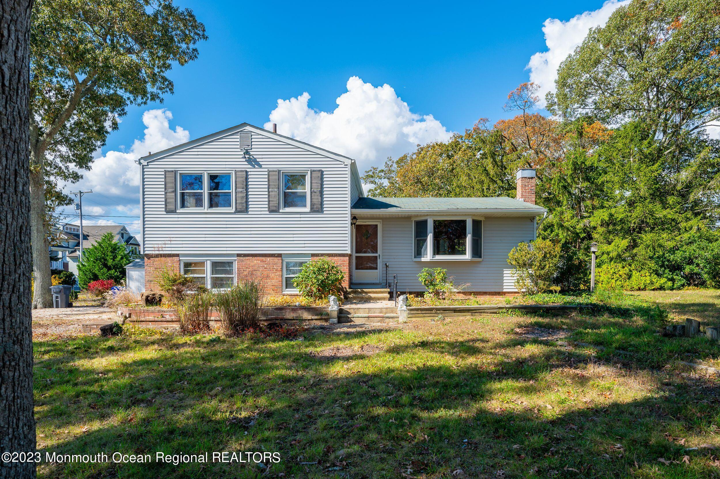 660 Pine Meadow Road Brick, NJ 08724 - Photo 36 of 67 a front view of house with garden