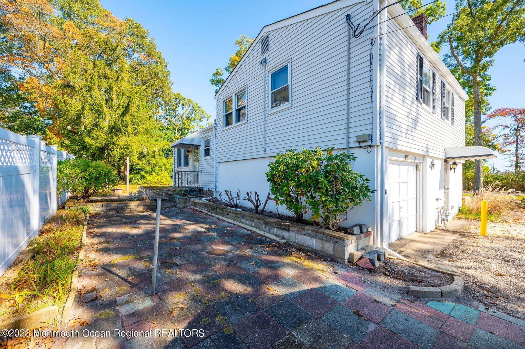 660 Pine Meadow Road Brick, NJ 08724 - Photo 52 of 67 a view of a back yard of the house