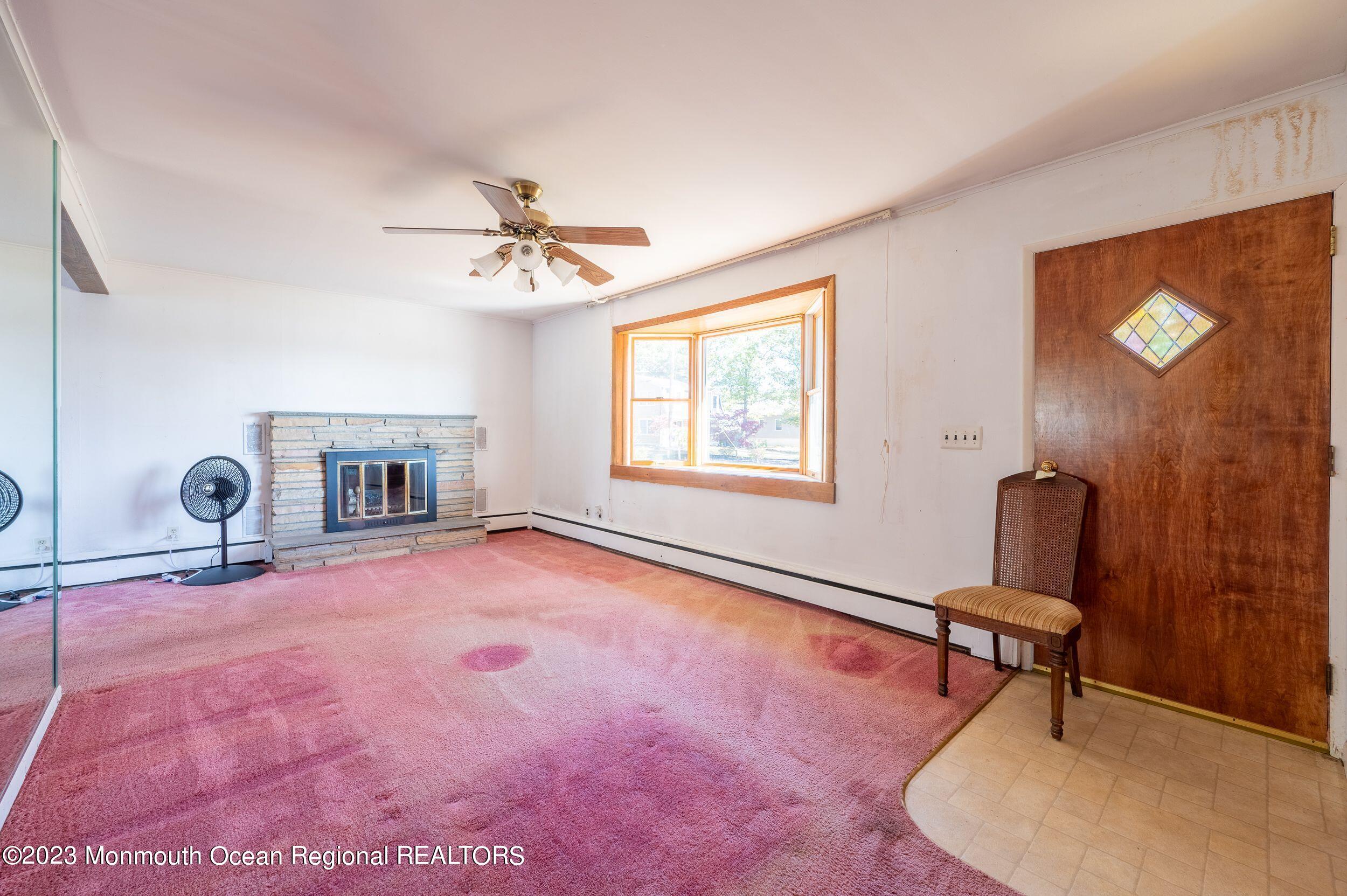 660 Pine Meadow Road Brick, NJ 08724 - Photo 9 of 67 a room with furniture and a window