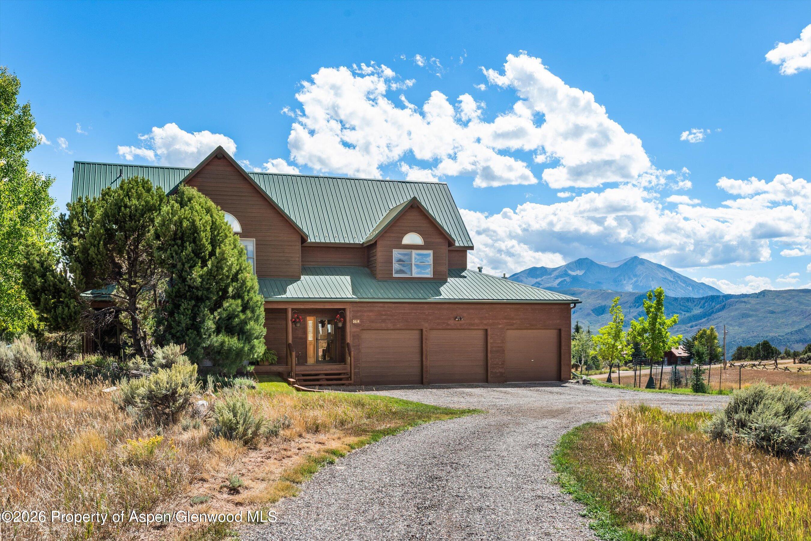614 Escalante Road Carbondale, CO 81623 - Photo 4 of 46 a front view of a house with garden