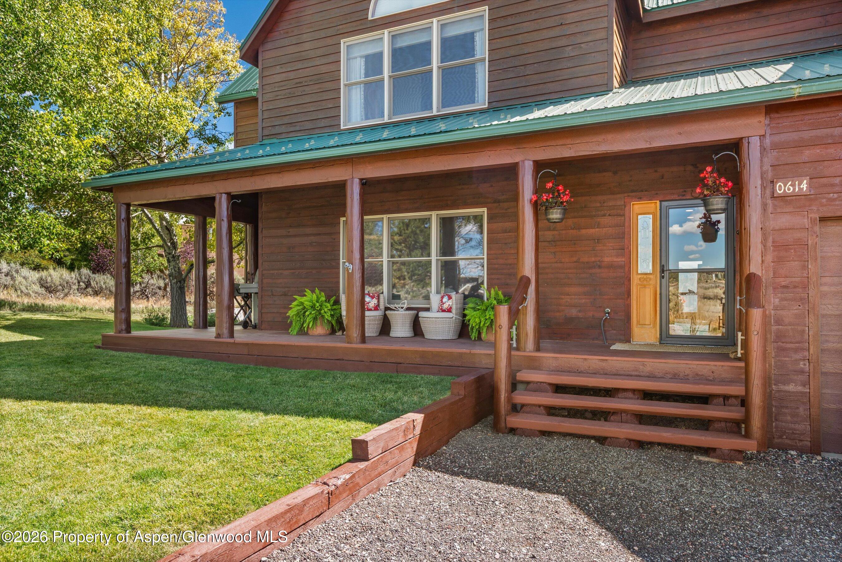 614 Escalante Road Carbondale, CO 81623 - Photo 5 of 46 a front view of a house with garden