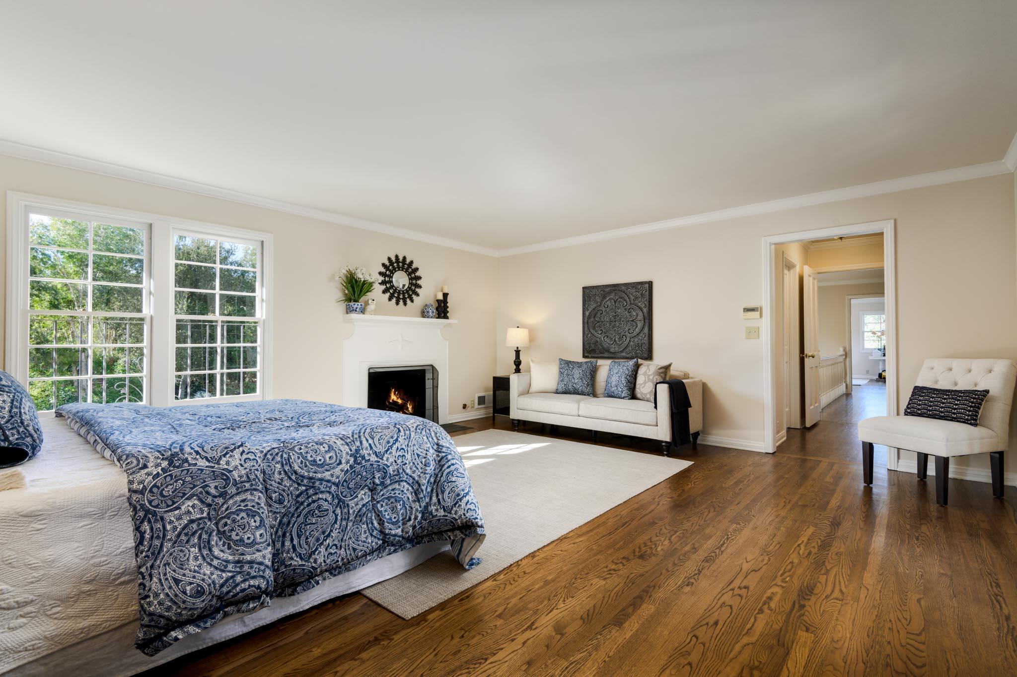 937 Arcady Road Santa Barbara, CA 93108 - Photo 12 of 31 a living room with a bed furniture and a fireplace