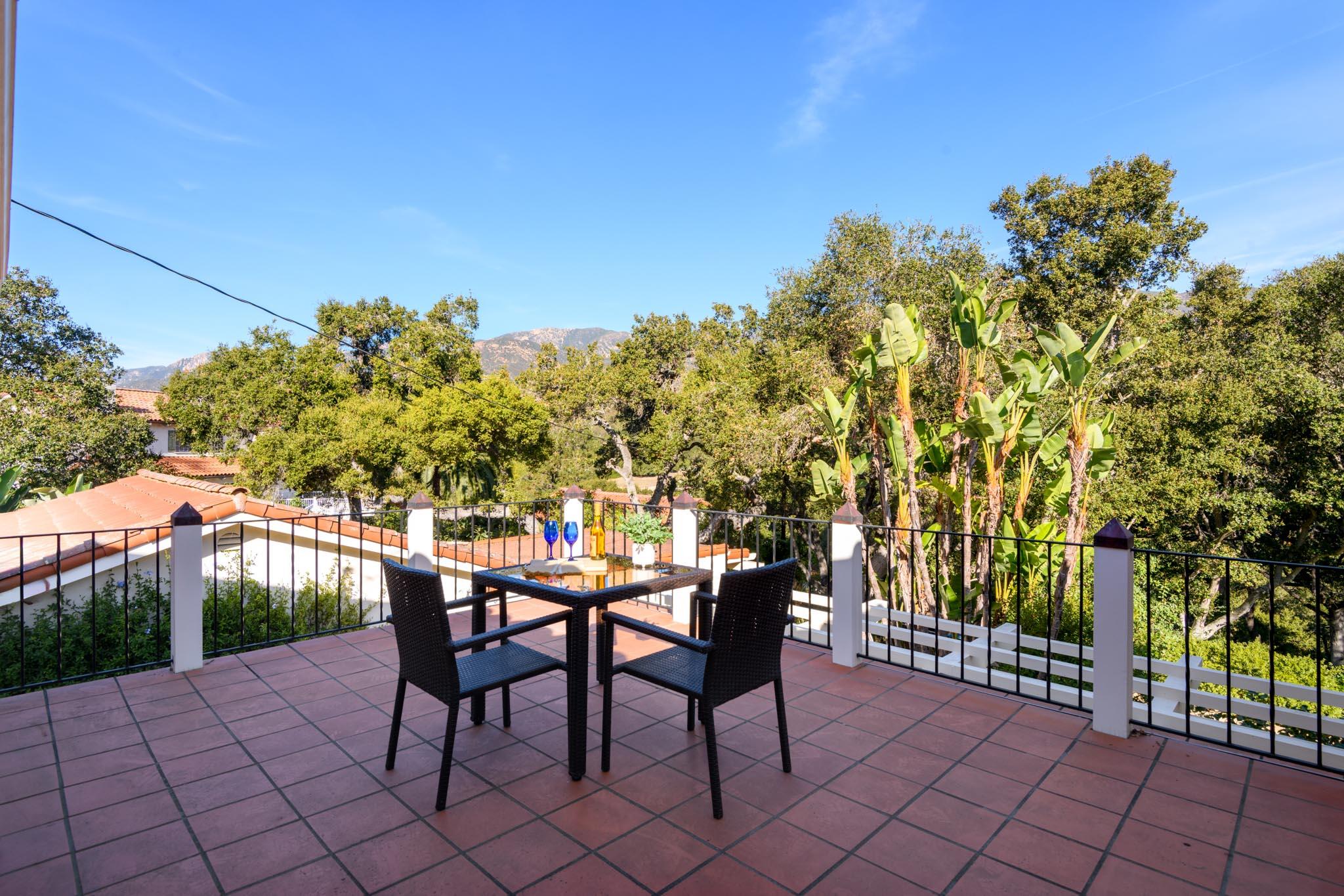 937 Arcady Road Santa Barbara, CA 93108 - Photo 18 of 31 a backyard of a house with table and chairs