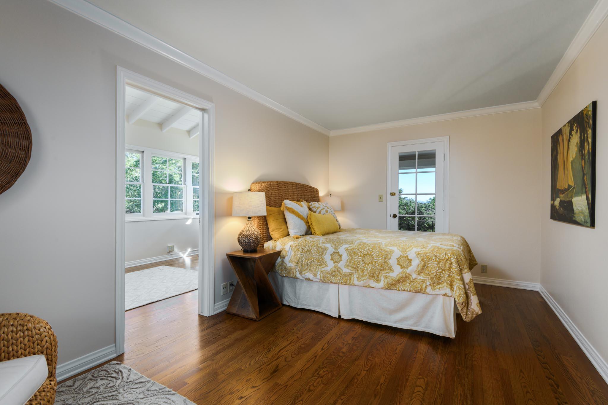 937 Arcady Road Santa Barbara, CA 93108 - Photo 19 of 31 a bedroom with a bed and wooden floor