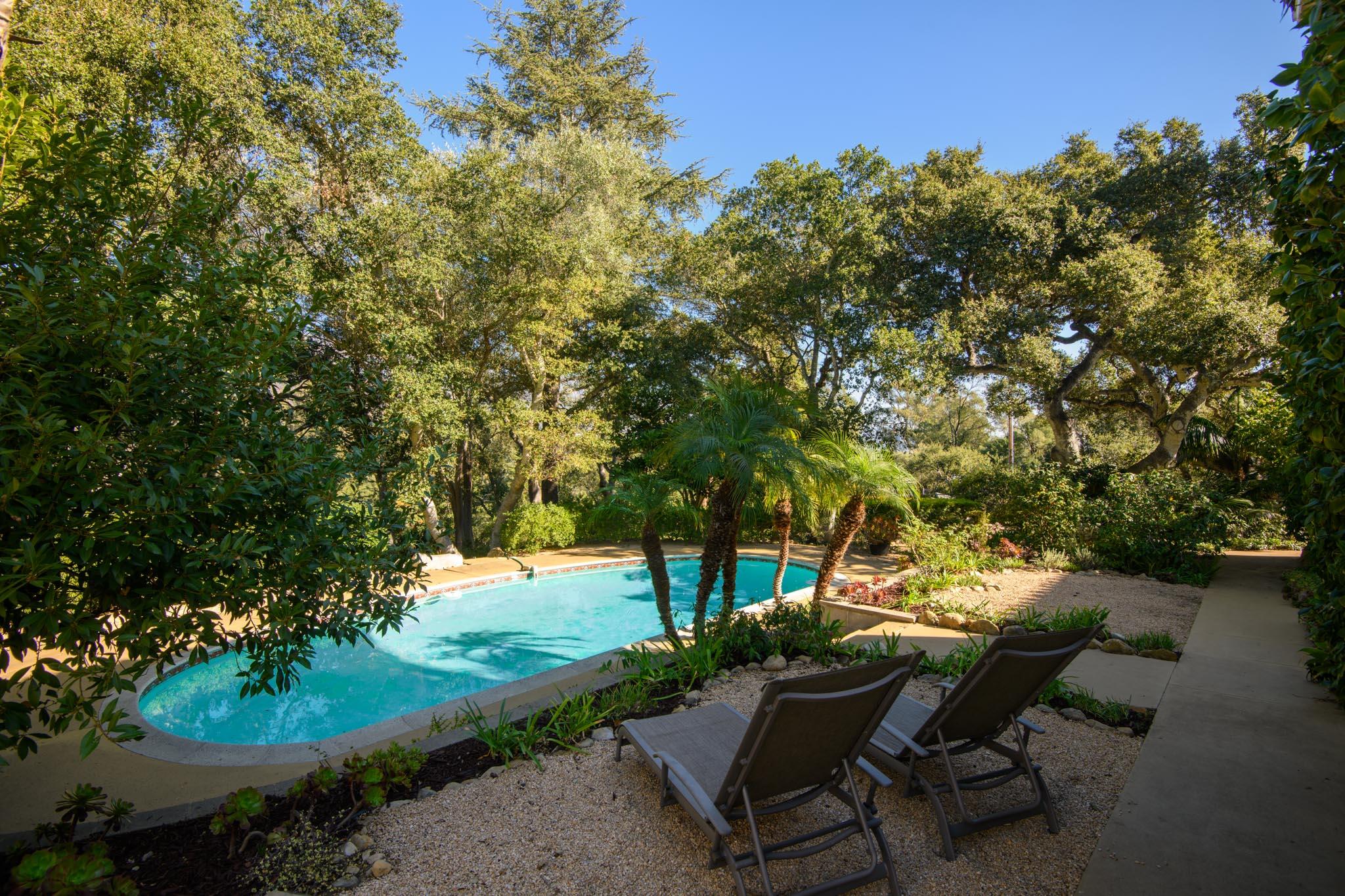 937 Arcady Road Santa Barbara, CA 93108 - Photo 24 of 31 a view of a backyard with table and chairs and a lake view