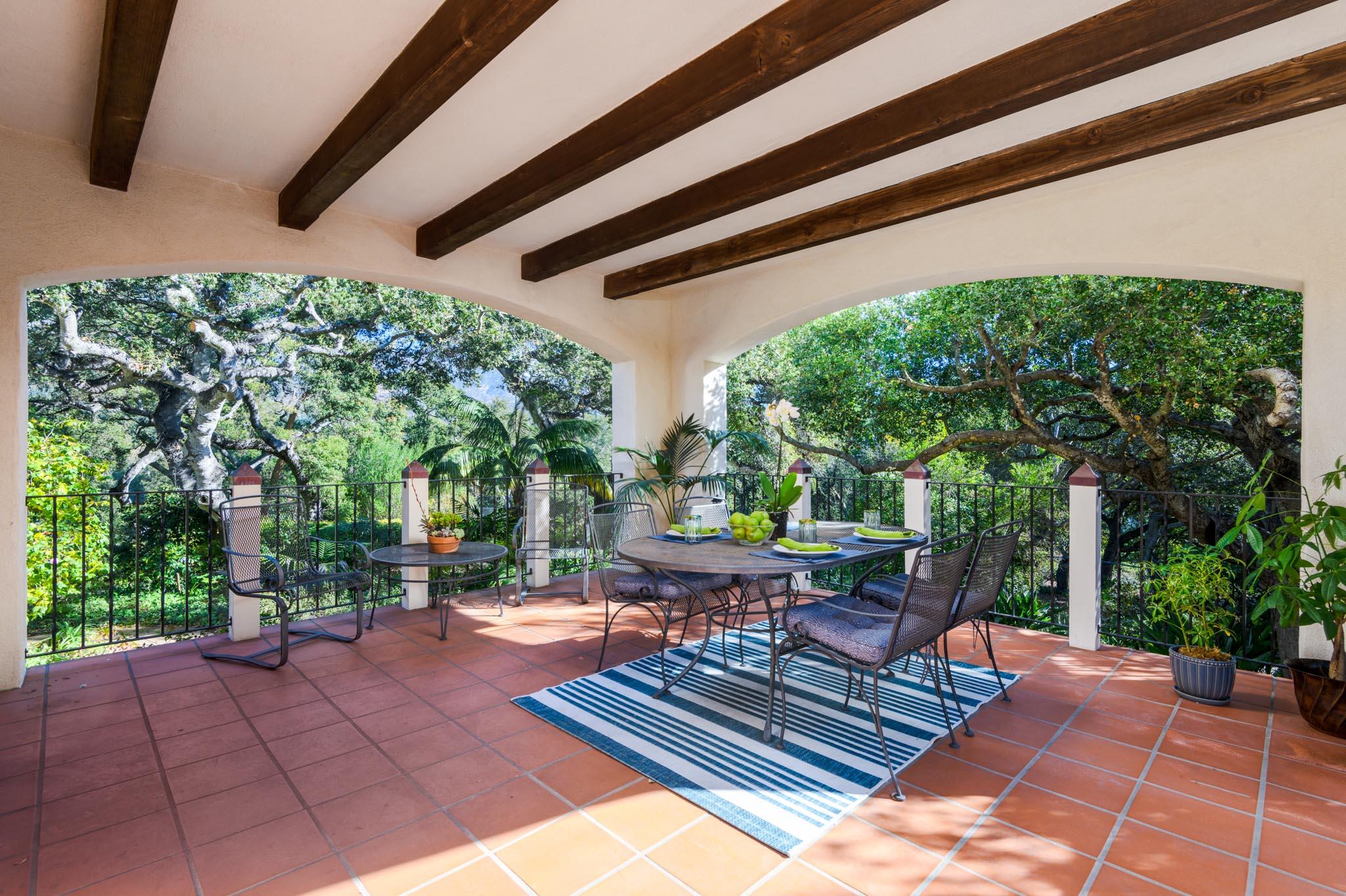 937 Arcady Road Santa Barbara, CA 93108 - Photo 5 of 31 a patio with glass top table and chairs