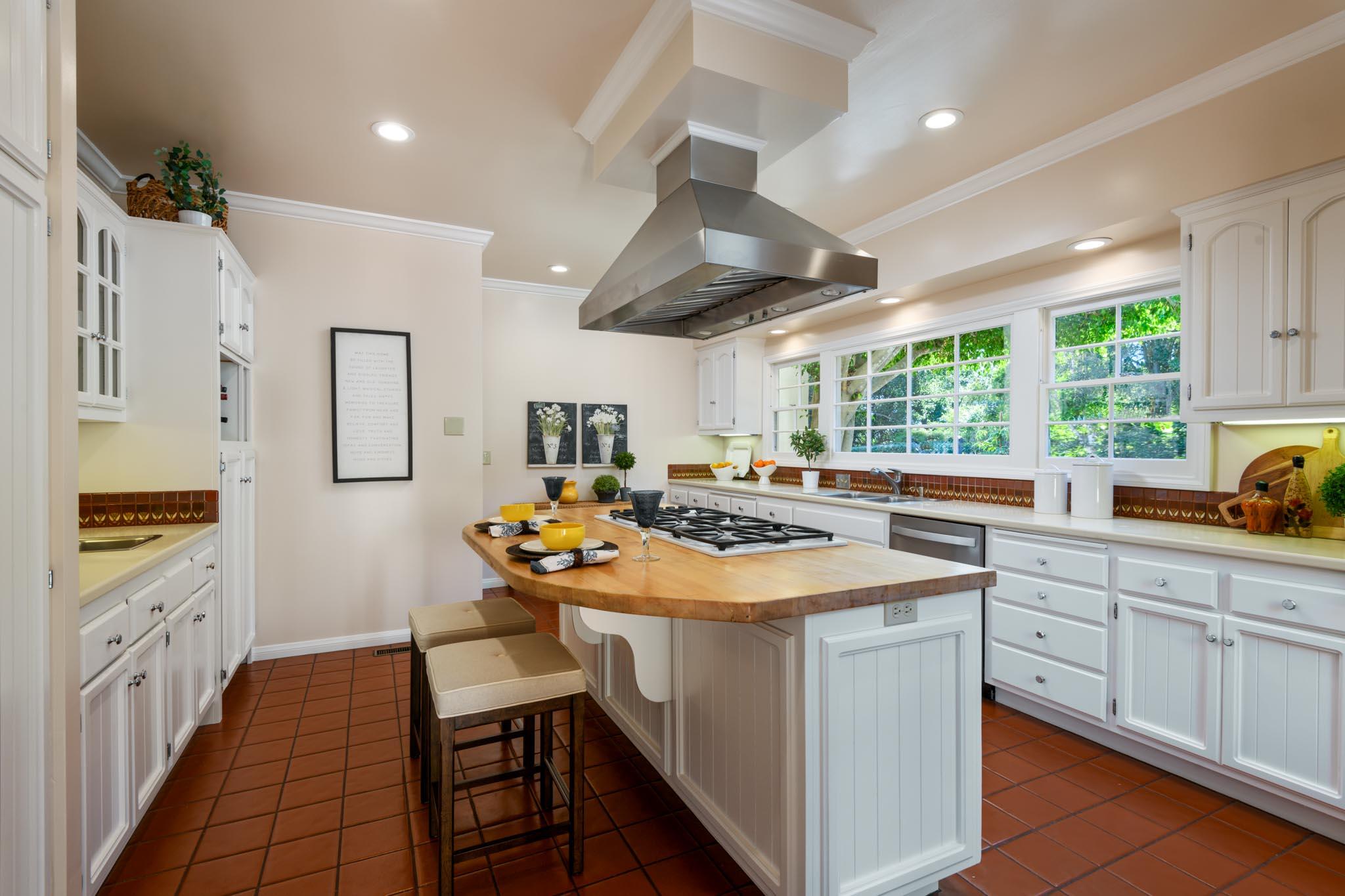 937 Arcady Road Santa Barbara, CA 93108 - Photo 8 of 31 a kitchen with a sink stove and cabinets