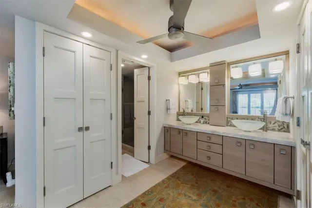 a bathroom with a double vanity sink and a mirror