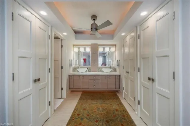 a bathroom with a double vanity sink a mirror and a shower