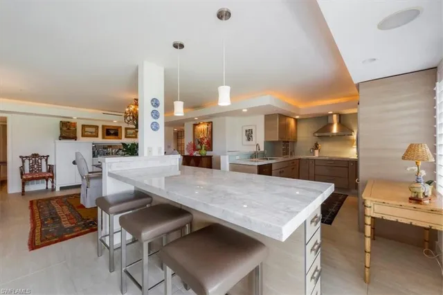 a living room with dining table and chairs