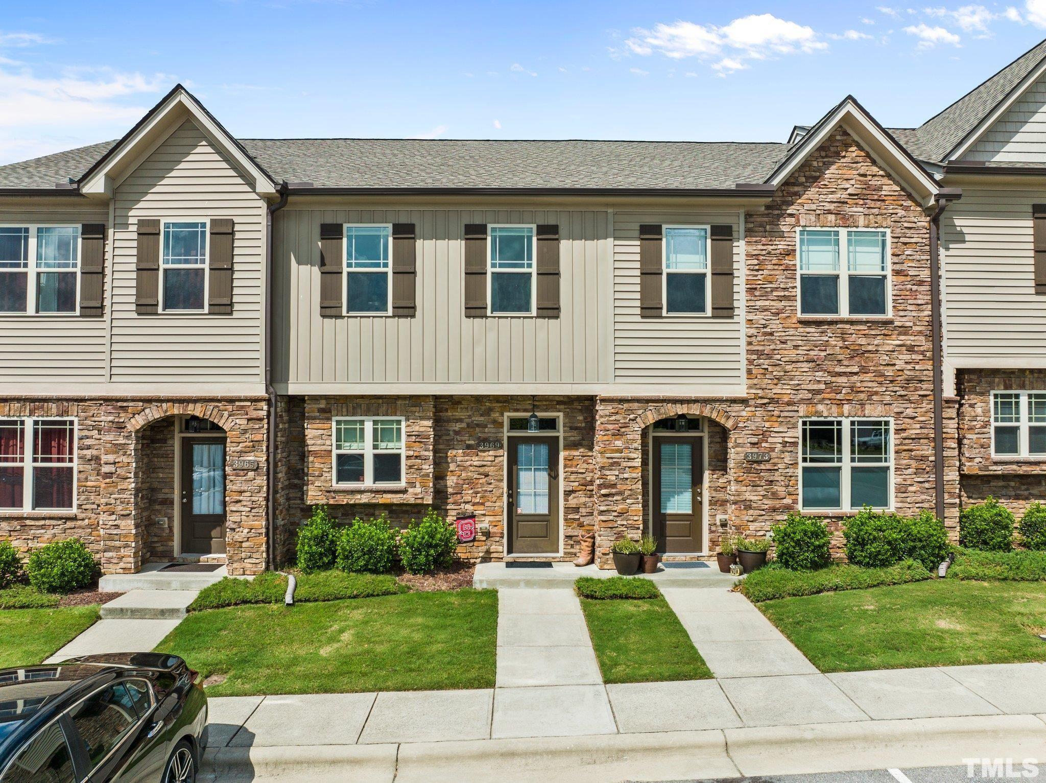 3950 Amelia Park Drive Raleigh, NC 27606 - Photo 1 of 20 a front view of a house with a yard