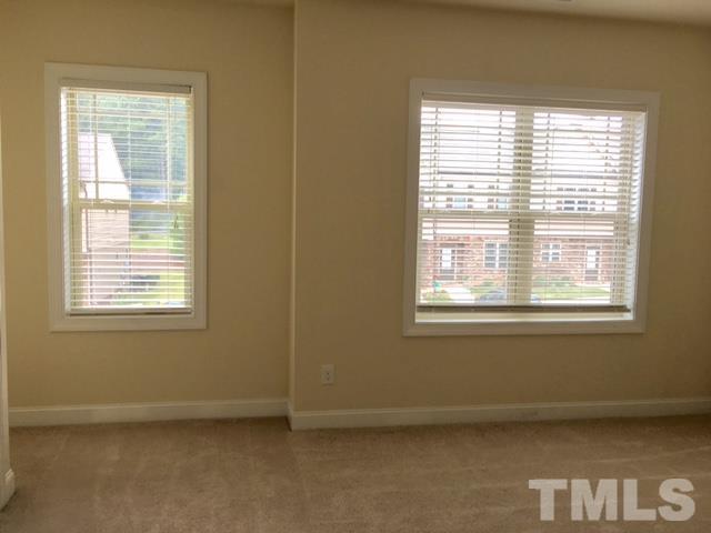 3950 Amelia Park Drive Raleigh, NC 27606 - Photo 9 of 20 a view of an empty room with a window