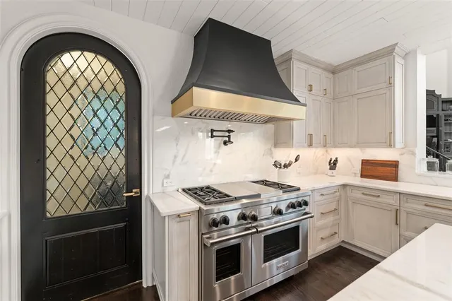 a bedroom with a bed and glass window