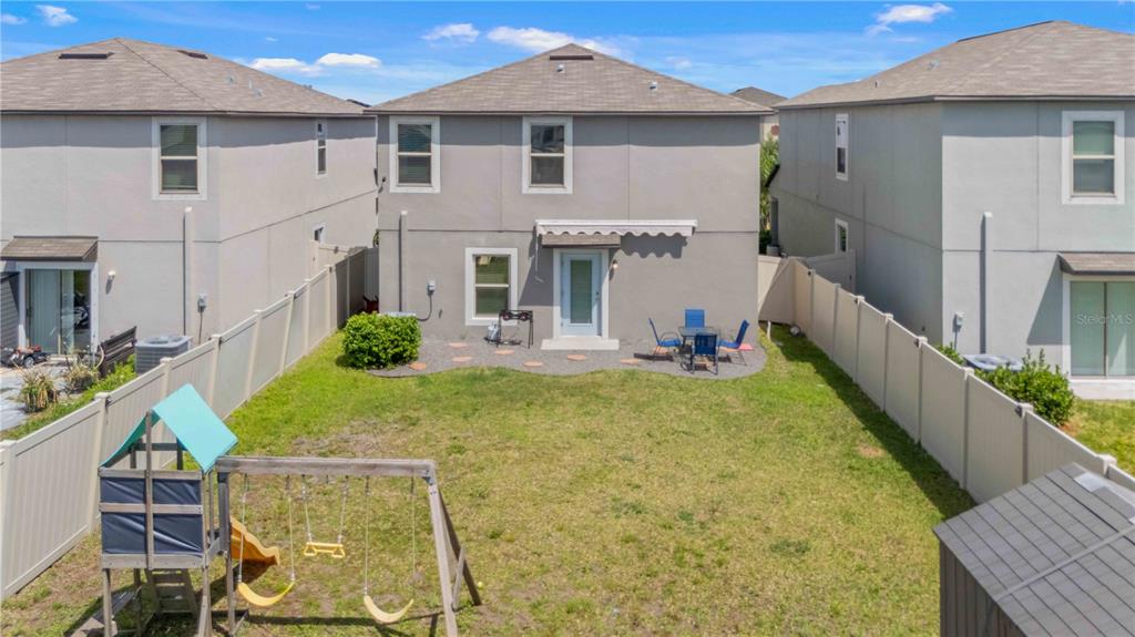 9440 Lemon Drop Loop Sun City Center, FL 33573 - Photo 5 of 55 a view of an house with backyard and furniture