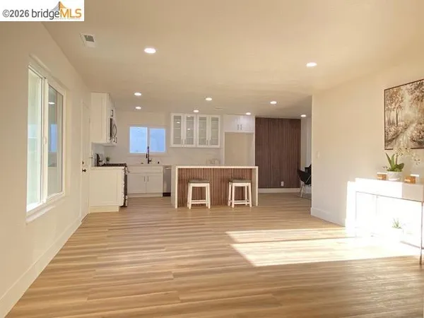 a view of a kitchen cabinets and a window