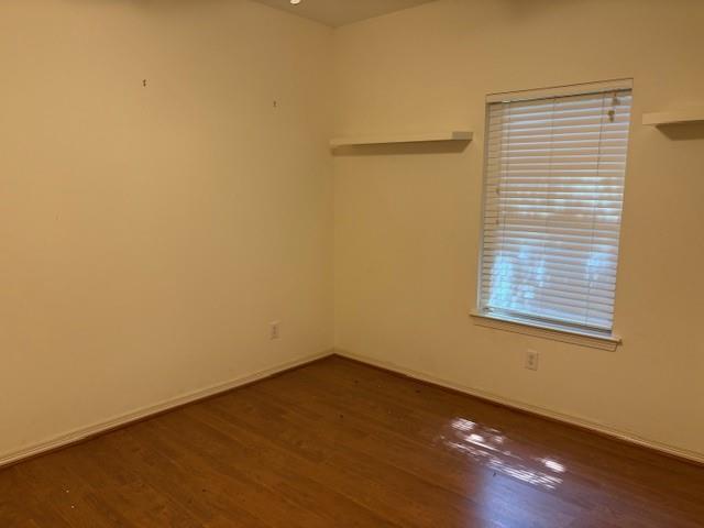 31205 Hegar Road Hockley, TX 77447 - Photo 13 of 17 a view of an empty room with wooden floor and a window