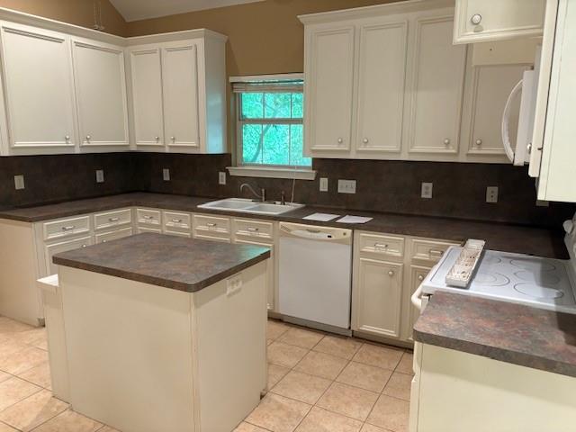 31205 Hegar Road Hockley, TX 77447 - Photo 7 of 17 a kitchen with a sink and cabinets
