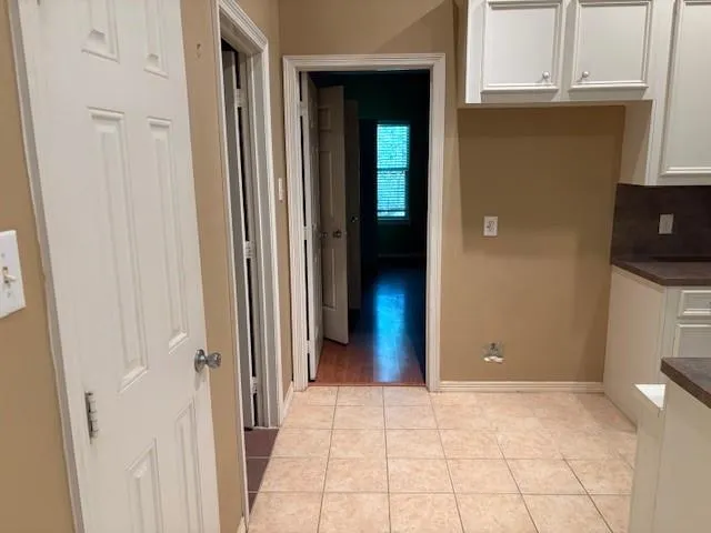 a view of an empty room and closet area