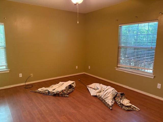 31205 Hegar Road Hockley, TX 77447 - Photo 10 of 17 a bed sitting in a bedroom next to a window