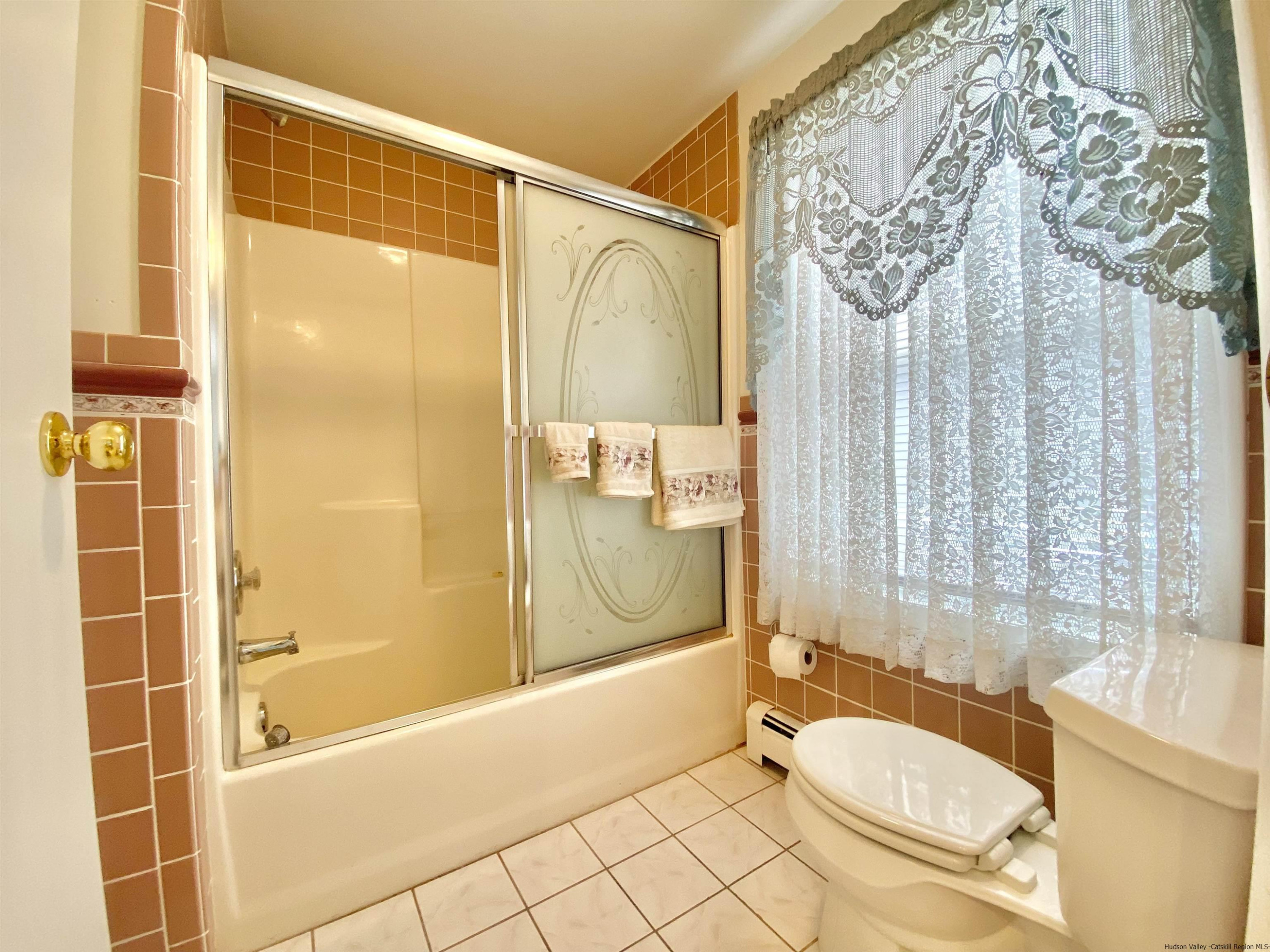 8 Pawan Circle Lake Katrine, NY 12449 - Photo 18 of 28 a bathroom with a granite countertop sink toilet and shower