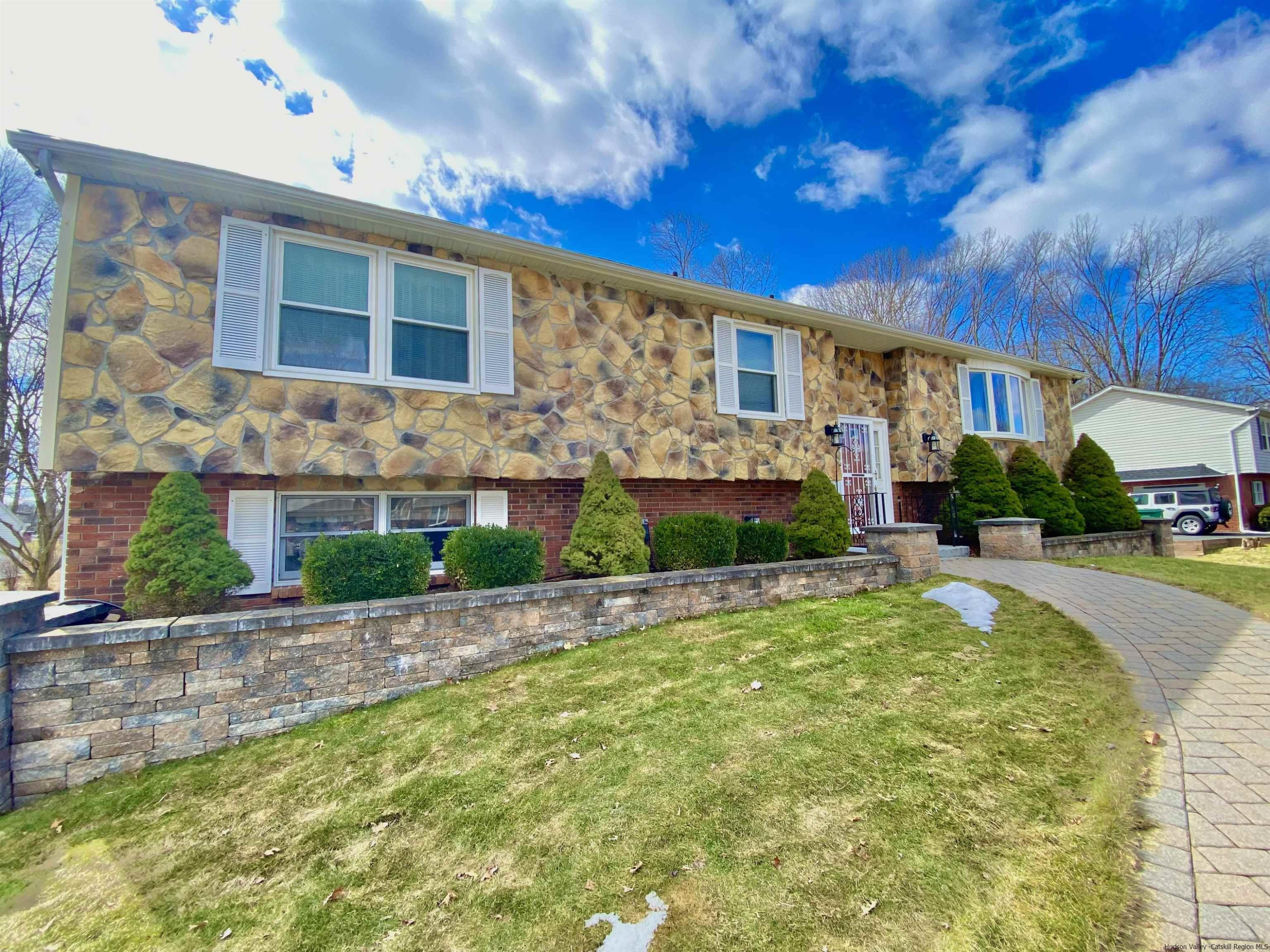 8 Pawan Circle Lake Katrine, NY 12449 - Photo 2 of 28 a front view of a house with a yard and outdoor seating