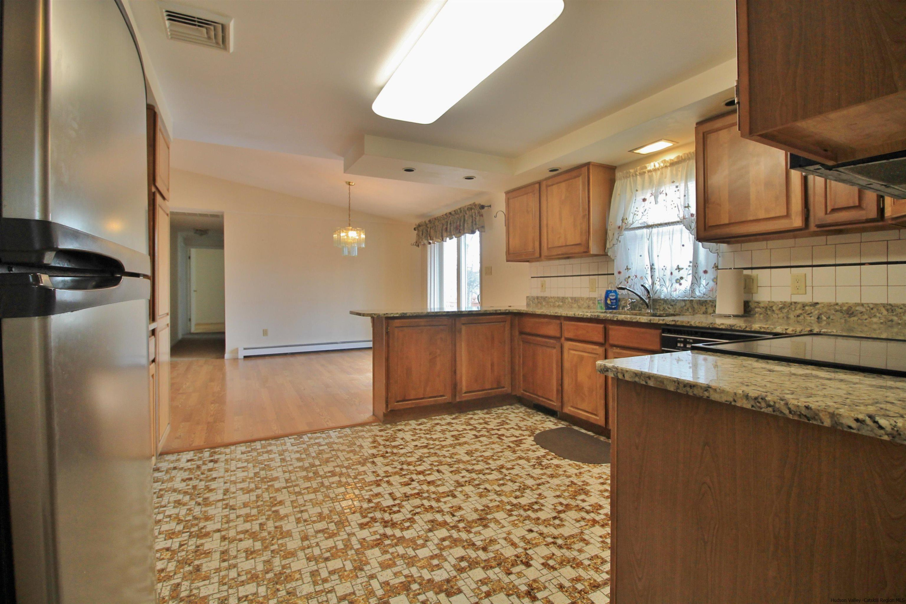 8 Pawan Circle Lake Katrine, NY 12449 - Photo 8 of 28 a kitchen with stainless steel appliances granite countertop a refrigerator a stove and a sink
