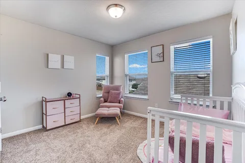 a bedroom with furniture and window