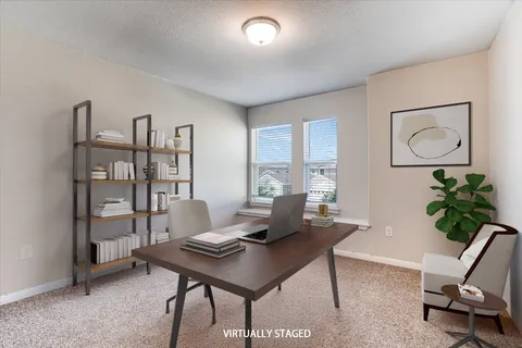 a workspace with furniture and window