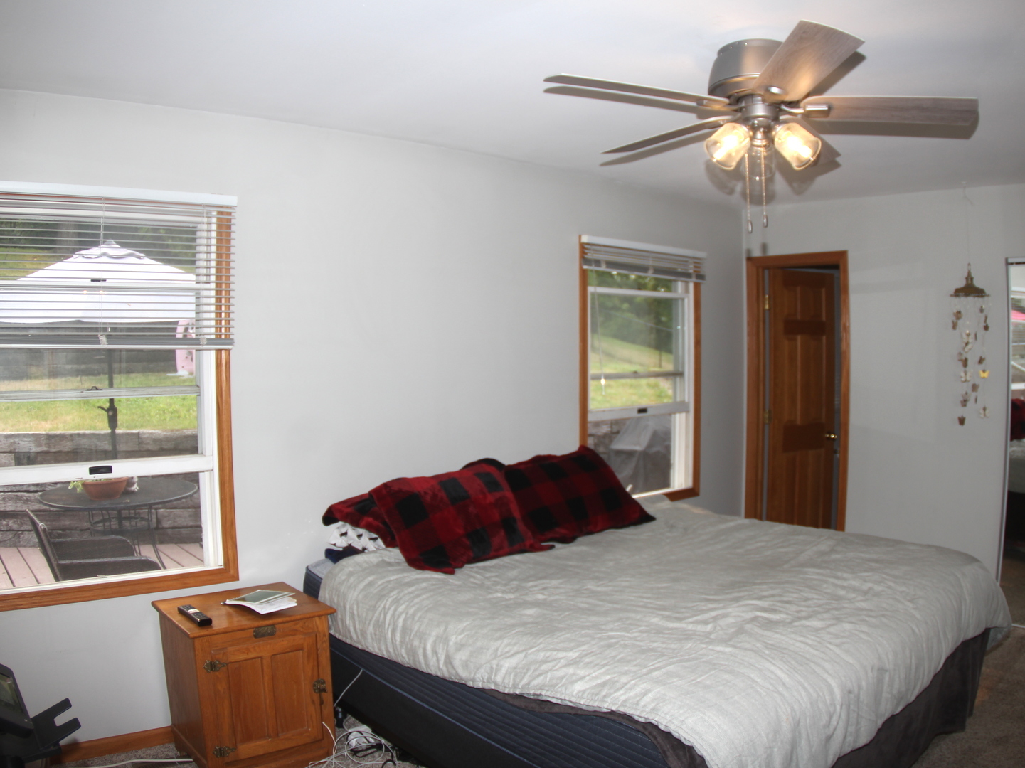 260 Thomas Street Cary, IL 60013 - Photo 14 of 16 a bedroom with a bed and a chandelier