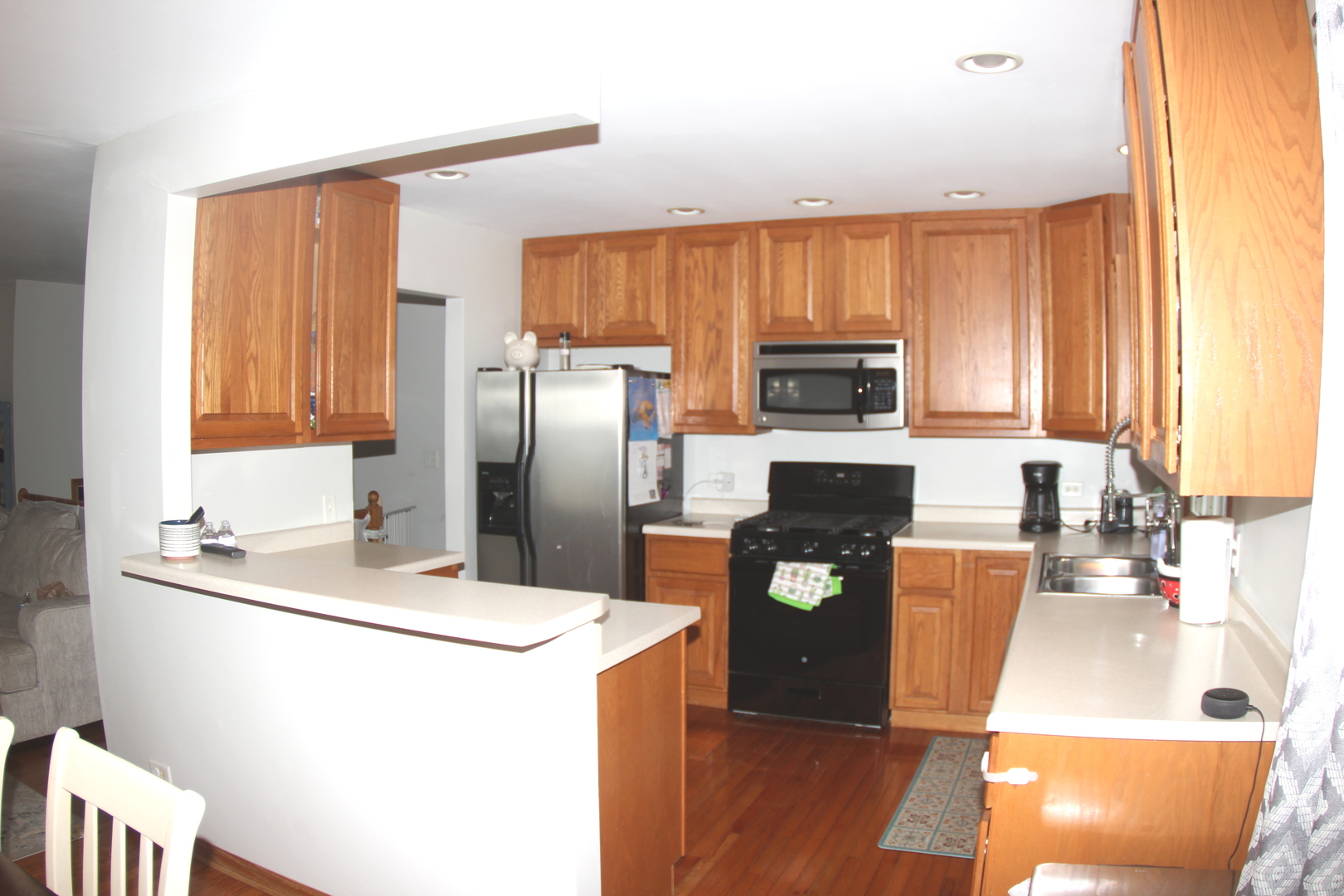 260 Thomas Street Cary, IL 60013 - Photo 4 of 16 a kitchen with granite countertop a refrigerator a stove a sink and dishwasher