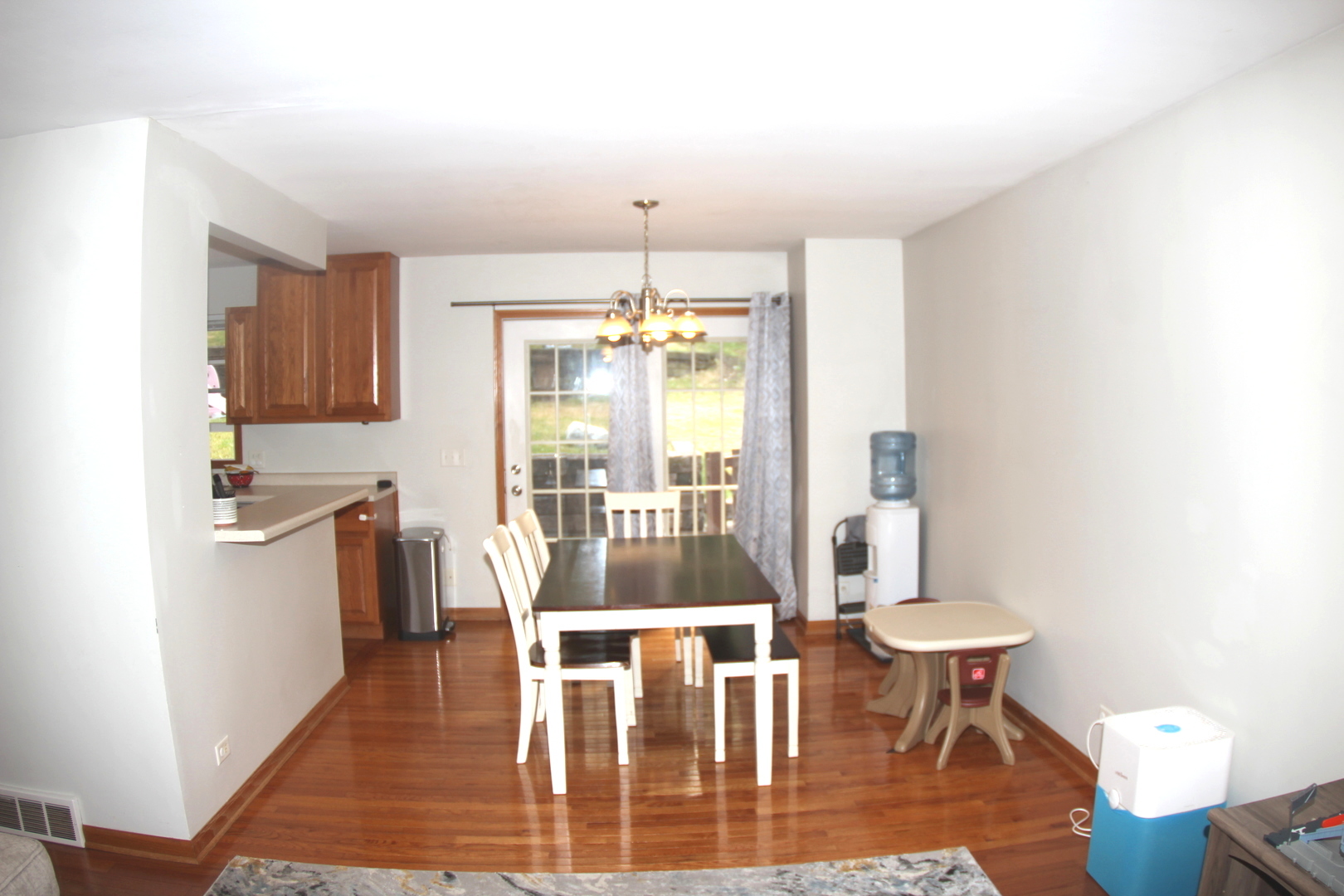 260 Thomas Street Cary, IL 60013 - Photo 5 of 16 a view of a dining room with furniture window and wooden floor