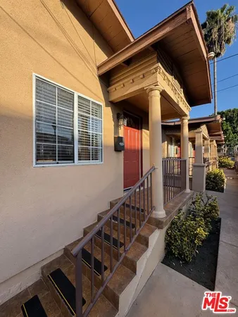 a view of a porch with wooden floor