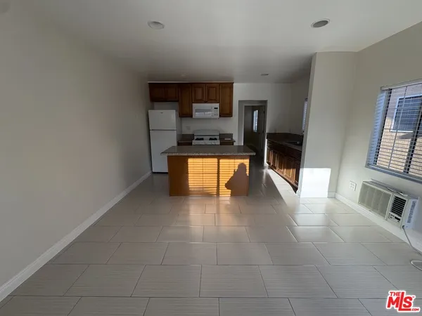 a view of kitchen with furniture and window