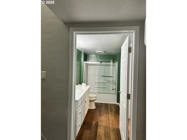 view of a bathroom with a sink and a mirror
