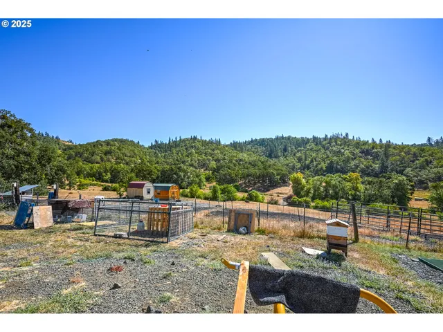 a view of house with outdoor space and backyard