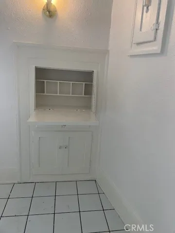a kitchen that has a sink a stove and a window