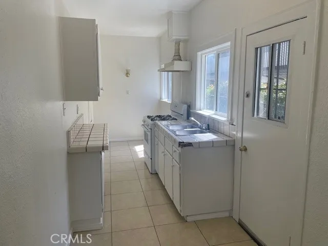 a bathroom with a double vanity sink and mirror