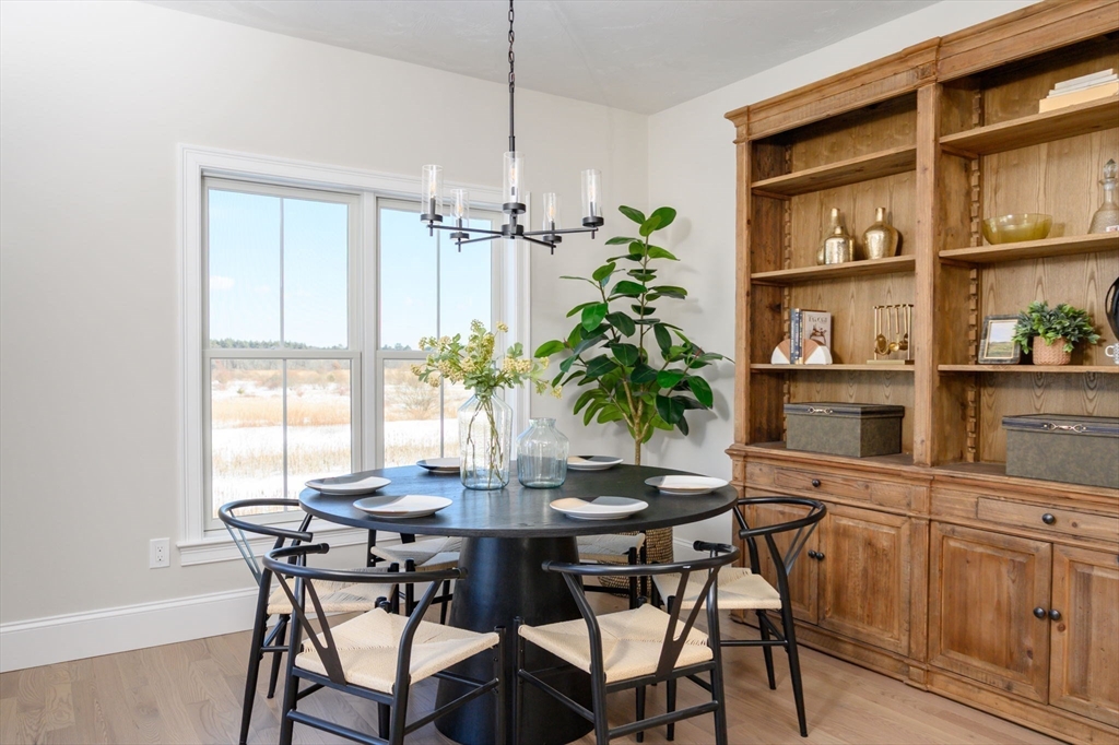 78 Metacomet Road, Unit 78 West Bridgewater, MA 02379 - Photo 18 of 39 a dining room with furniture and window