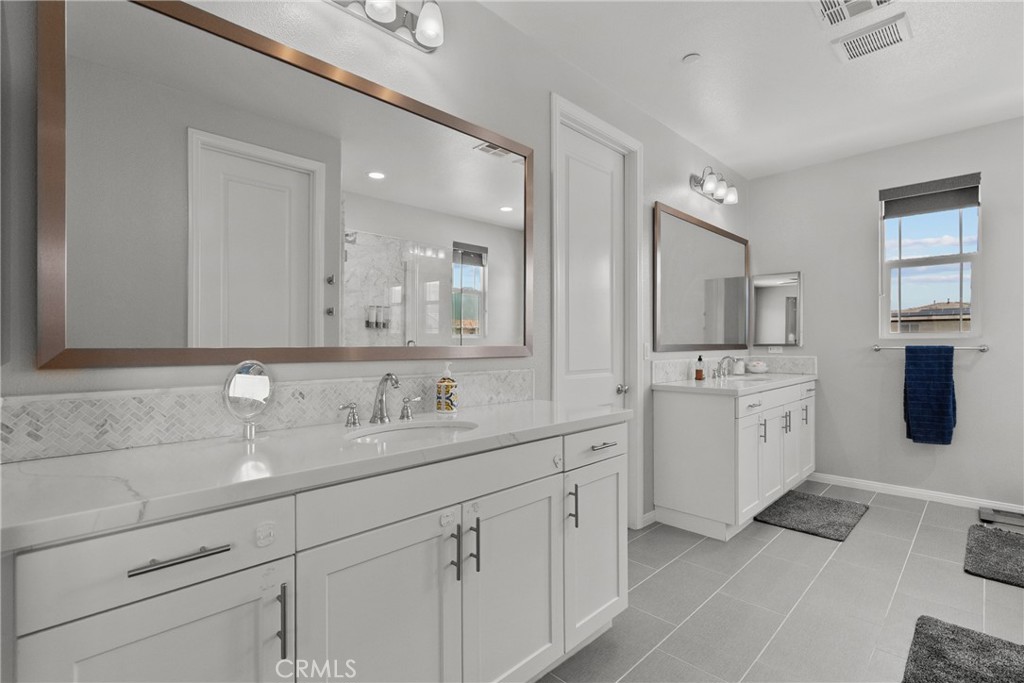232 River Street Fillmore, CA 93015 - Photo 42 of 61 a bathroom with a sink double vanity and a mirror