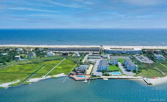 a view of a swimming pool with an outdoor space and seating area