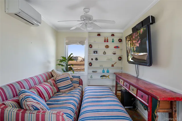 a bedroom with furniture and a chandelier