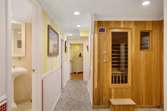 a view of a hallway with wooden shelves