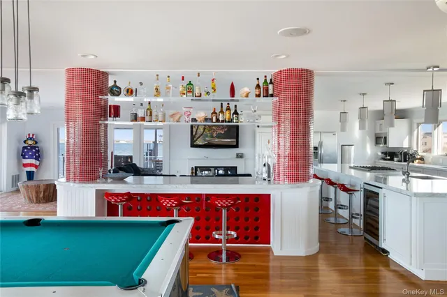 a kitchen with stainless steel appliances granite countertop a refrigerator and a stove