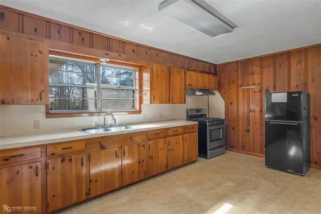 a view of a refrigerator in a kitchen