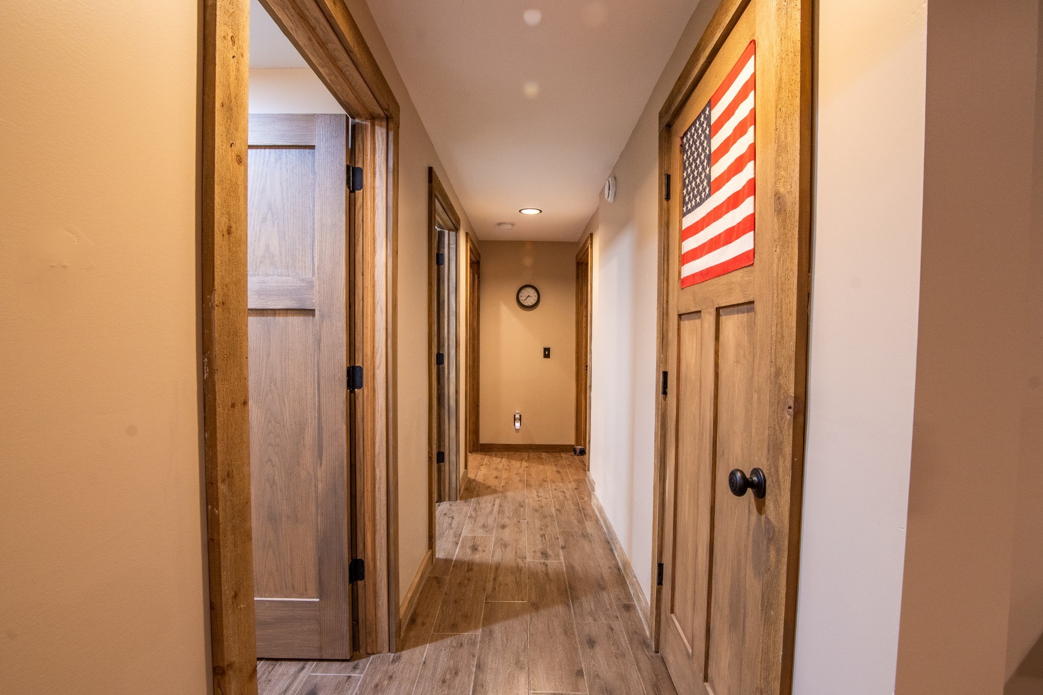102 Highwater Road Waverly, TN 37185 - Photo 30 of 43 a view of a hallway with wooden floor and a bathroom