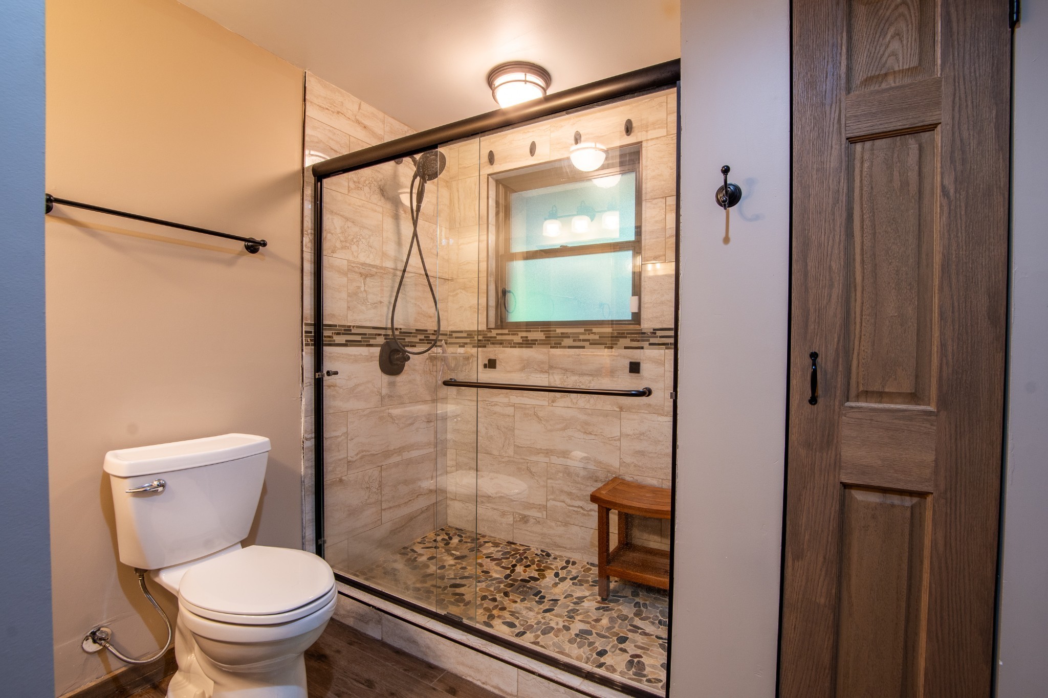 102 Highwater Road Waverly, TN 37185 - Photo 31 of 43 a bathroom with a toilet and a shower