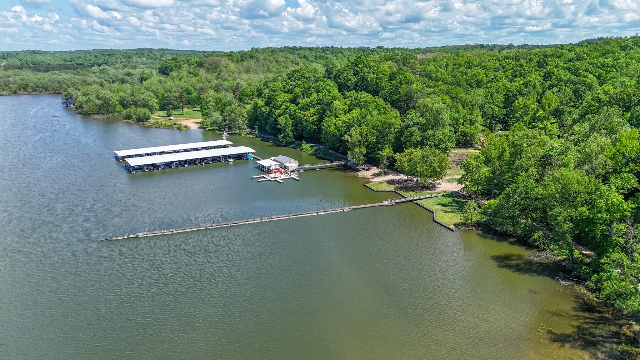 102 Highwater Road Waverly, TN 37185 - Photo 40 of 43 a view of a lush green space and lake view