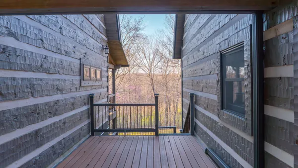 a bathroom with a granite countertop toilet sink and mirror
