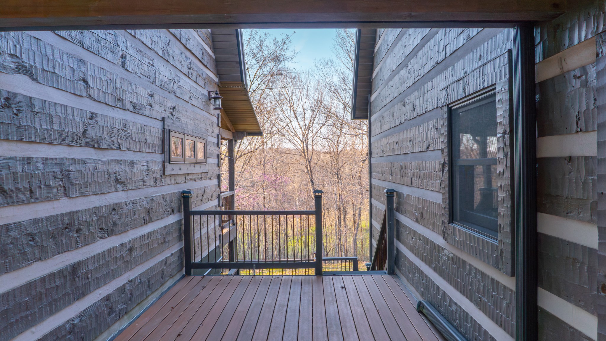 102 Highwater Road Waverly, TN 37185 - Photo 9 of 43 a view of a balcony with wooden floor and iron stairs