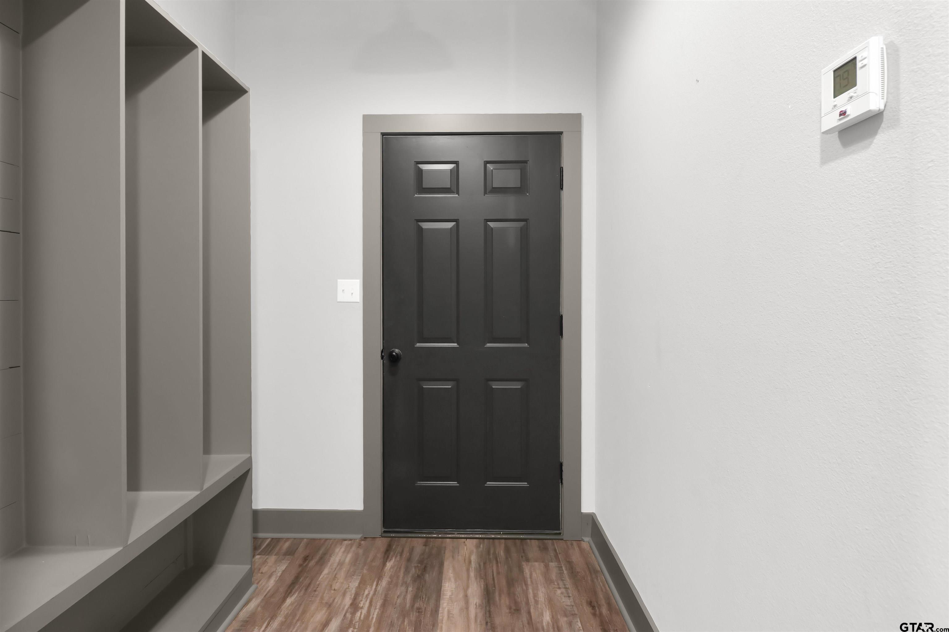 220 Sherman Street Rusk, TX 75785 - Photo 18 of 33 a view of a hallway with wooden floor